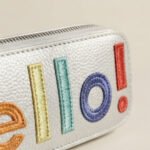 "Hello!" Graphic Metallic Pouch-Silver with Multicolored Lettering - Image 2